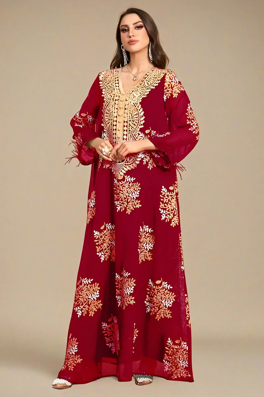 Front view of the Mhaya garnet feather-sleeve kaftan with ornate gold plastron embroidery.