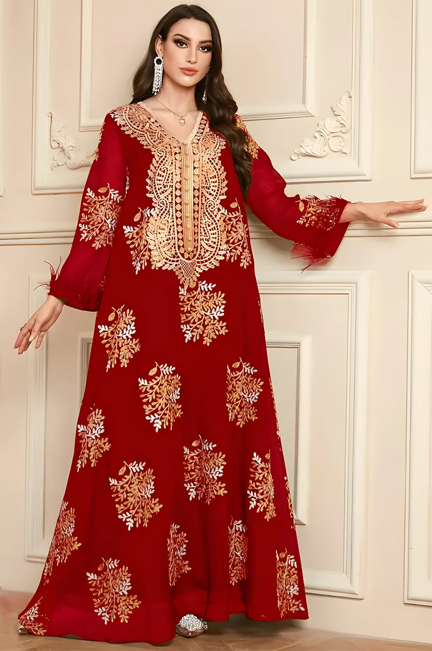 Detailed view of the V-neck plastron with lattice gold embroidery on the Mhaya garnet kaftan.