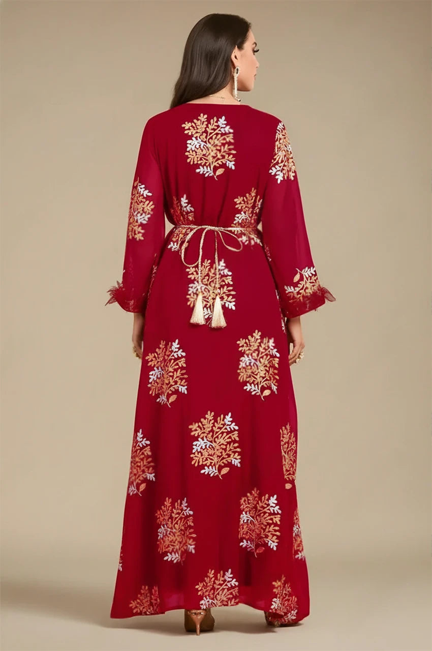 Studio back view of Mhaya garnet feather sleeve kaftan showing gold botanical embroidery