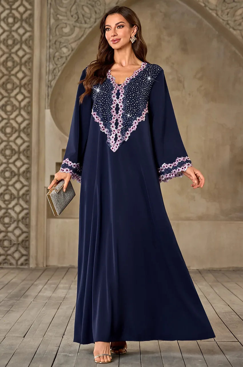 Milah kaftan styled with silver accessories for evening wear.