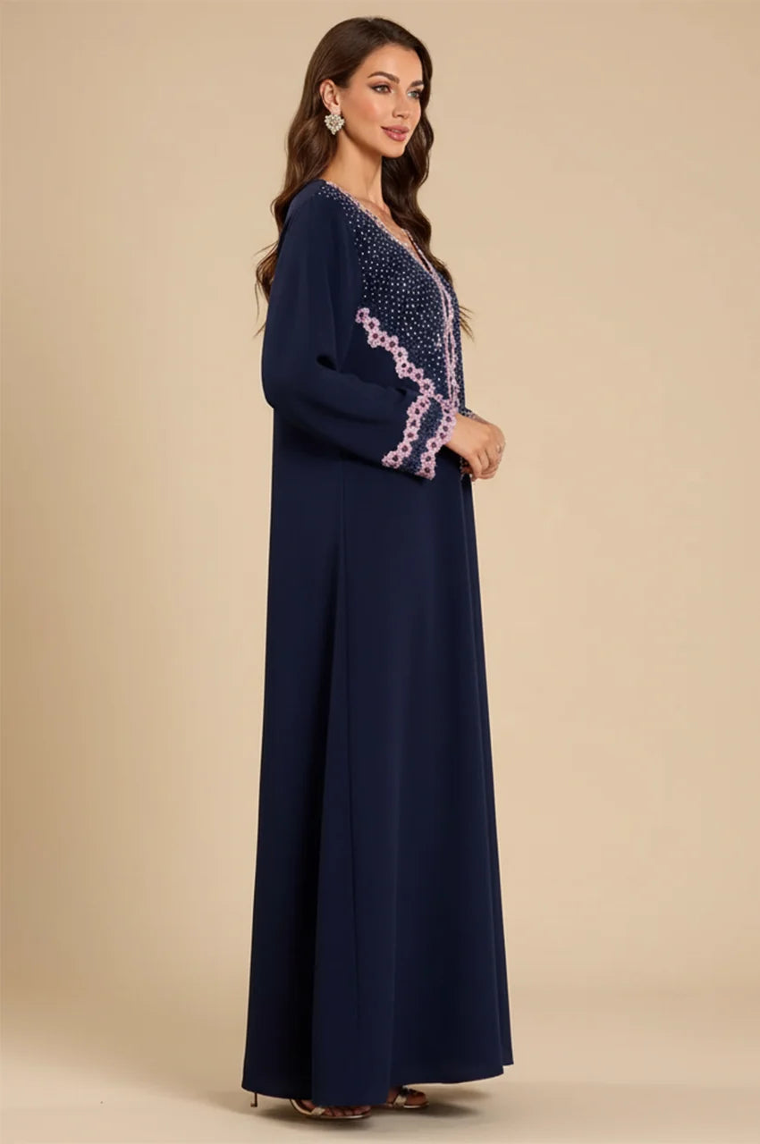 Side profile of Milah embellished kaftan showing sleeve detail.