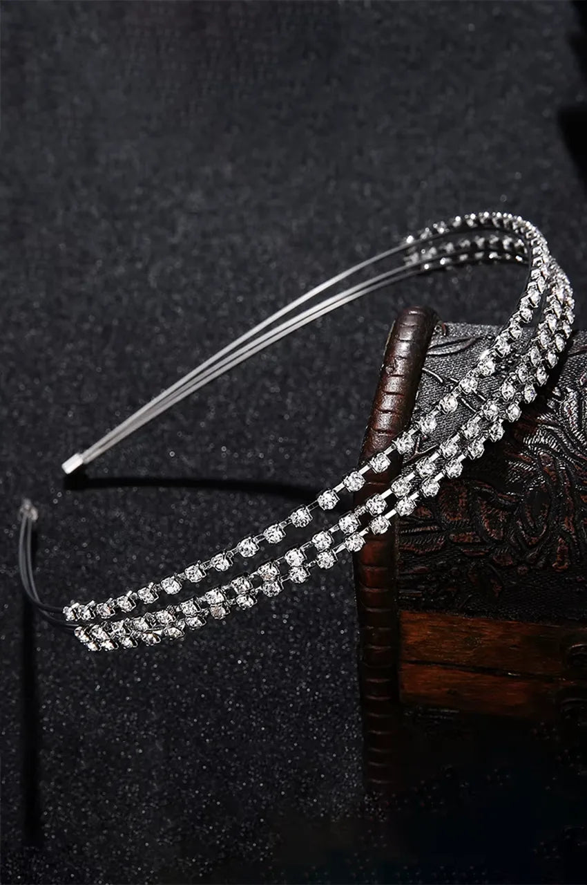 Floating view of double-strand silver crystal hair hoop showing flexible shape.
