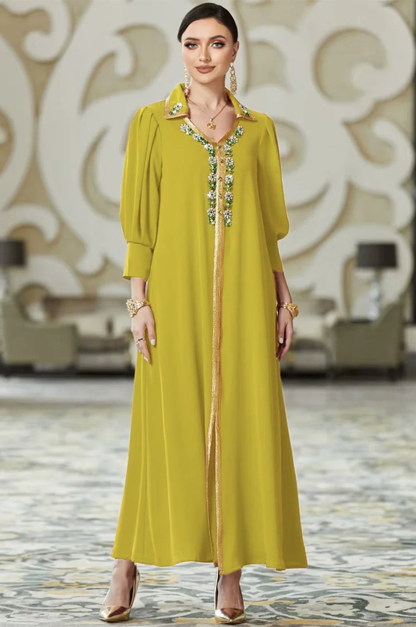 Full length view of the Karia chartreuse green orient kaftan dress featuring a modern cut and intricate gold embroidery details.