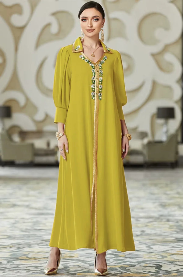 Full length view of the Karia chartreuse green orient kaftan dress featuring a modern cut and intricate gold embroidery details.