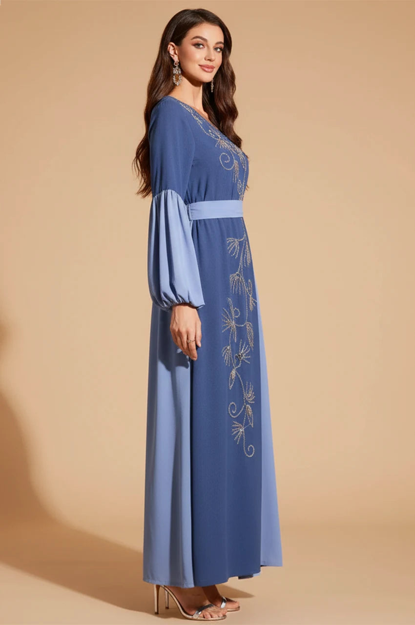 Side profile of Zaria dress highlighting voluminous bishop sleeves and pleats.