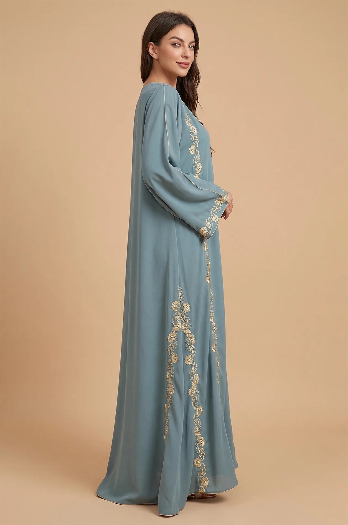 Side profile highlighting the bell sleeves of the Tahra kaftan.