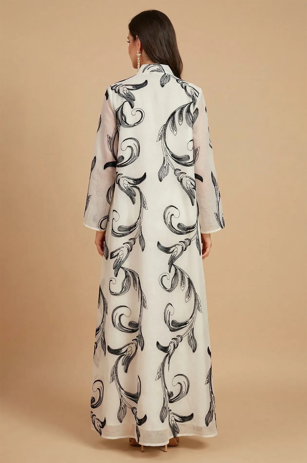 Back view of the Mylah kaftan showing the continuous black scroll print.