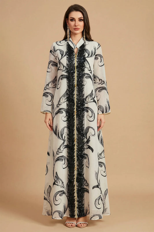 Full front view of Mylah white maxi kaftan with black beaded trim.