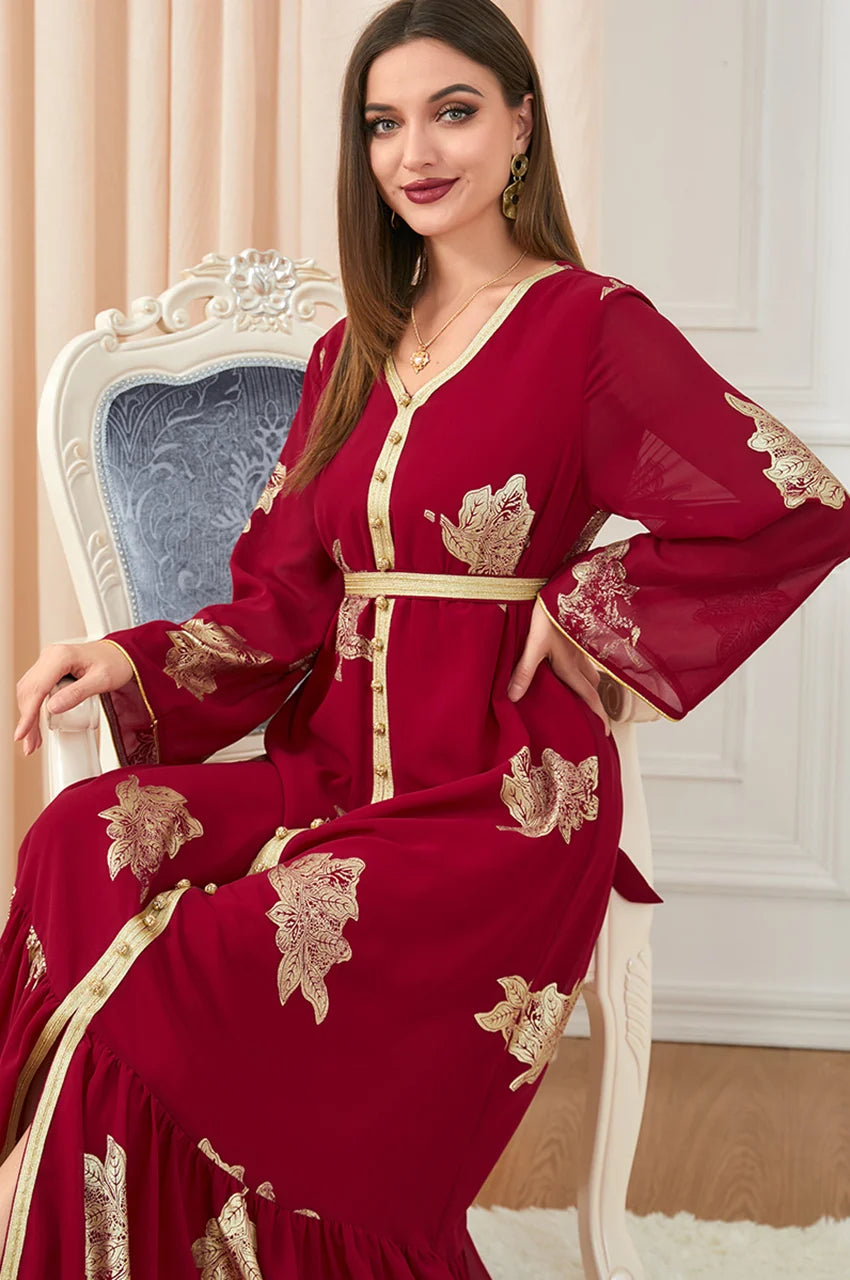 Portrait view of red Myra vintage Moroccan kaftan showcasing gold leaf embroidery