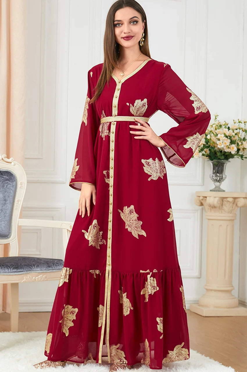 Full-body glamour shot of red Myra vintage Moroccan kaftan with statement embroidery