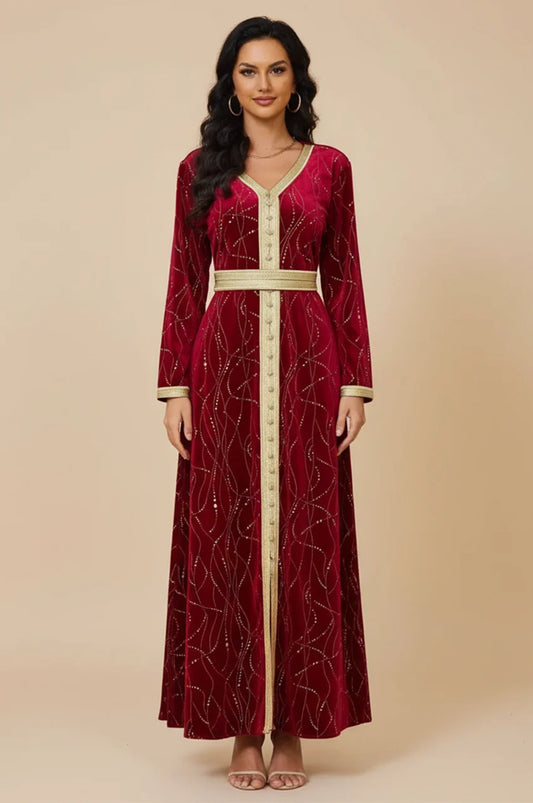 Studio shot of Naeva burgundy velvet kaftan showing floral embroidery panel.