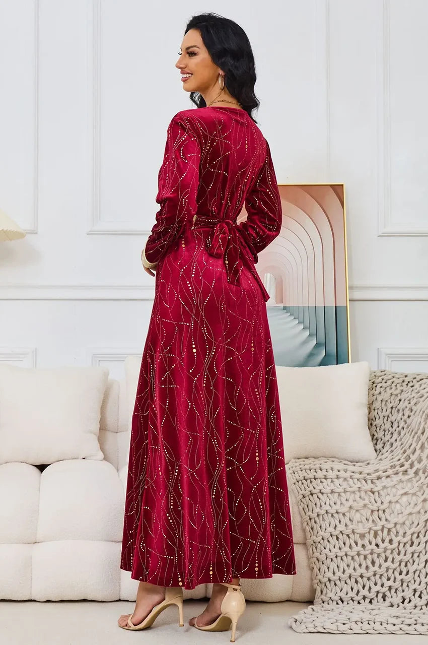 Rear angle of Naeva kaftan highlighting the velvet texture and belt tie.
