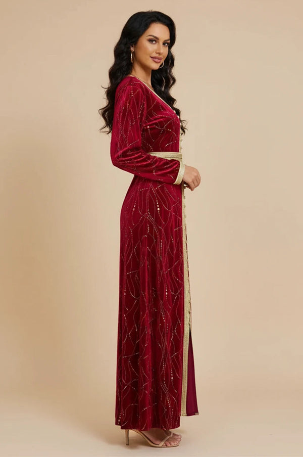 Side profile of Naeva velvet kaftan showing gold belt and sleeve details.