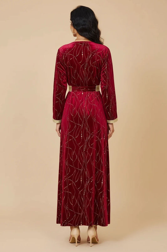 Back view of Naeva burgundy velvet maxi dress showing continuous gold pattern.