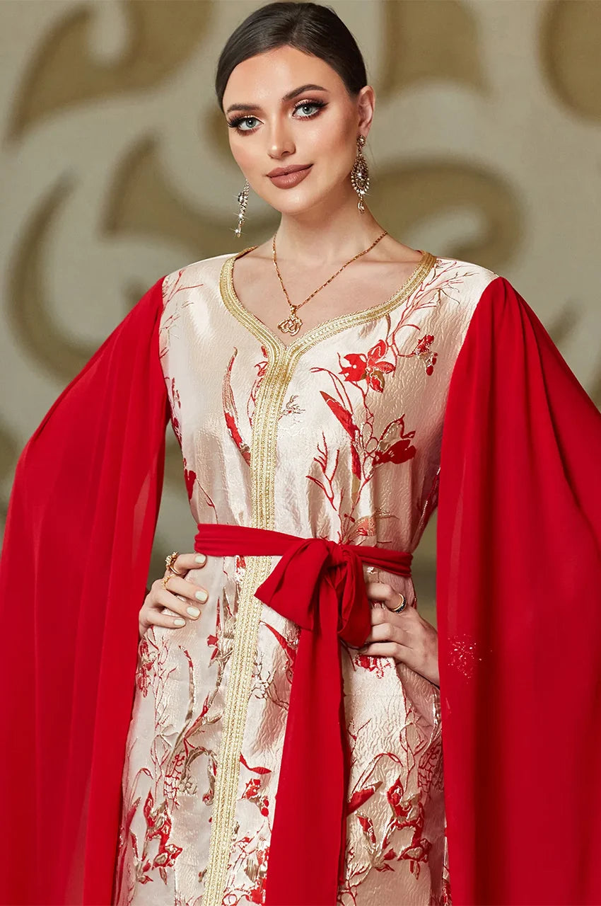 Close-up of neckline and embroidery on red and white kaftan dress