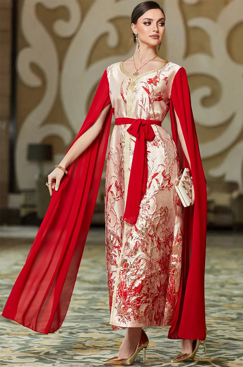 Flowing cape sleeves on red and white kaftan dress in motion