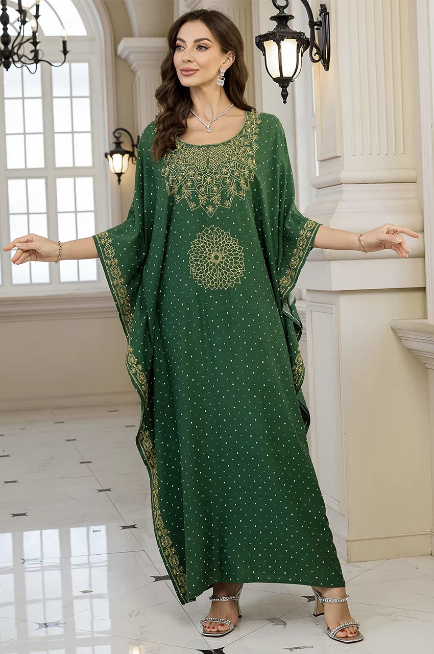 Side draped view of Nalya green cotton kaftan showing gold embroidery details