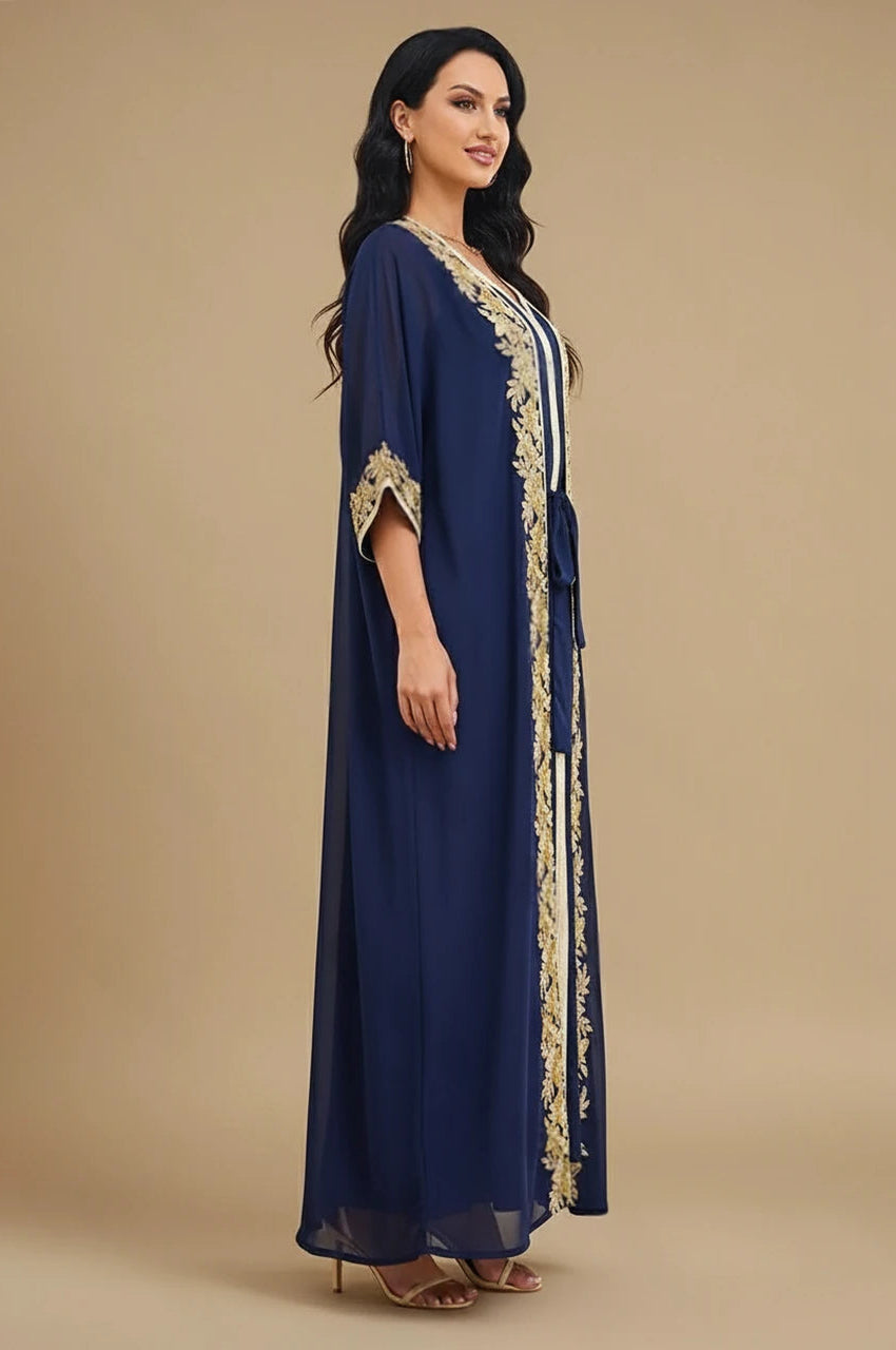 Side profile of the navy blue and gold kaftan highlighting the flowing chiffon sleeves and adjustable fit.