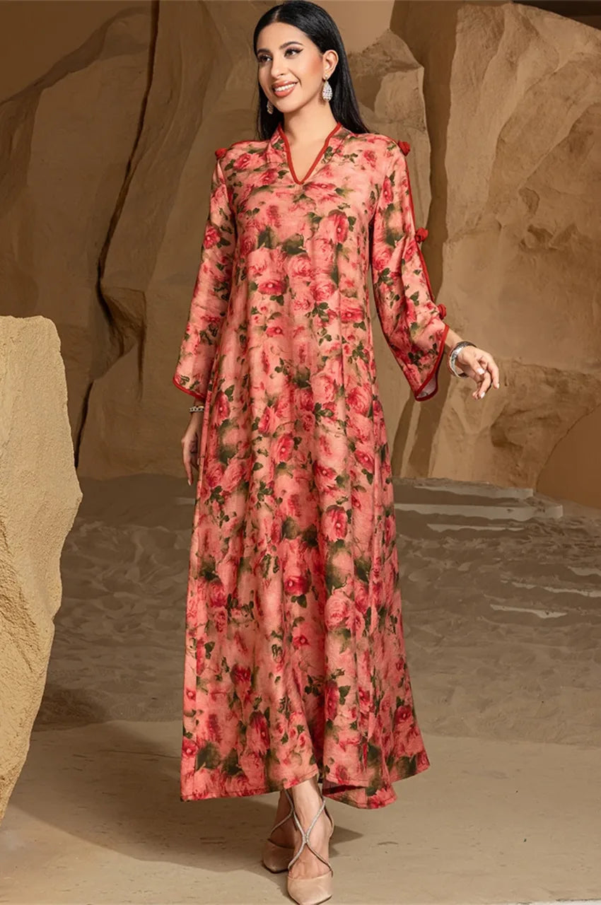 Model walking in Nayela red floral kaftan