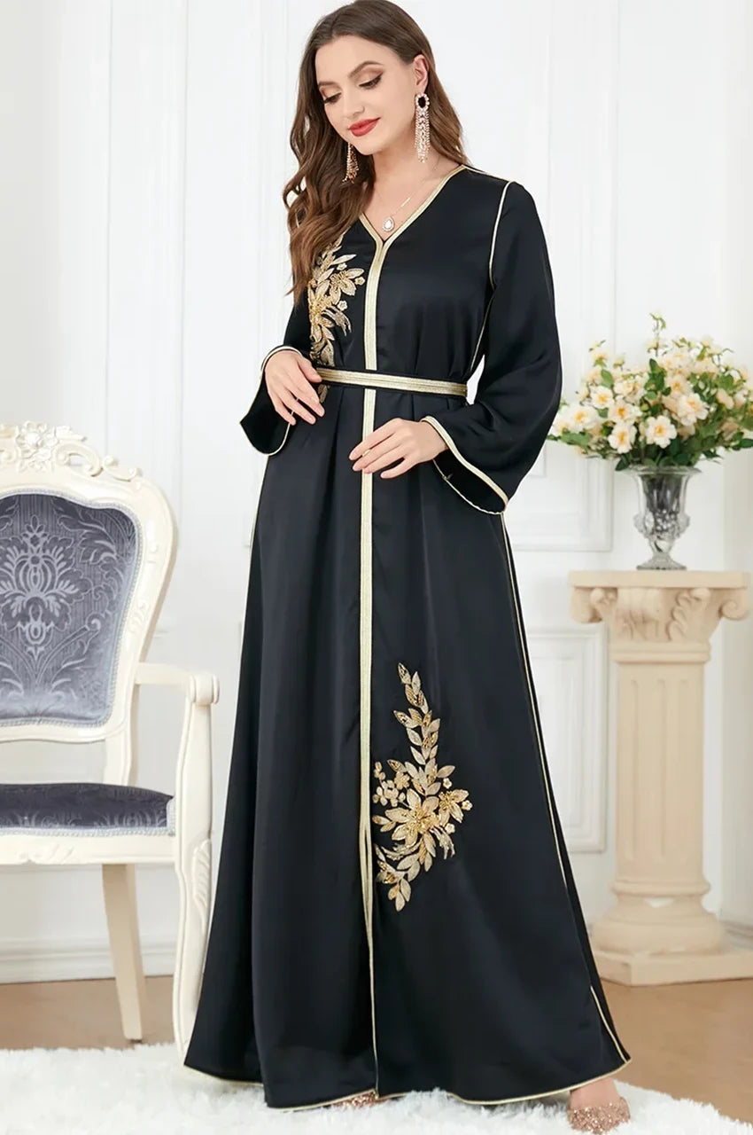 Full-length black satin Moroccan kaftan with gold details