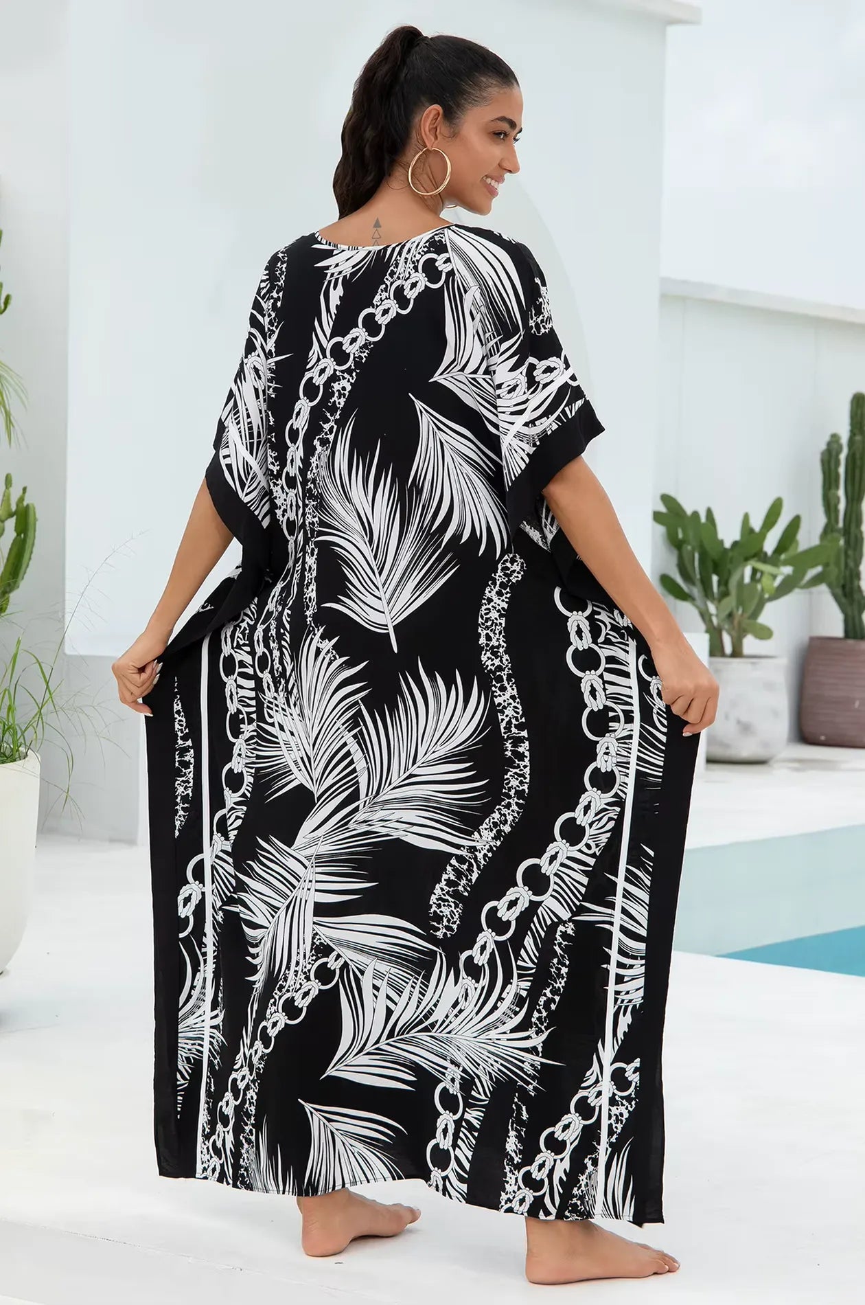 Naylara Adhara Palm Beach Kaftan Black – Back View at the Pool