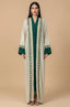 Full-length front view of the Ameline beige kaftan dress featuring an emerald green inner gown and hand-beaded borders by Naylara.