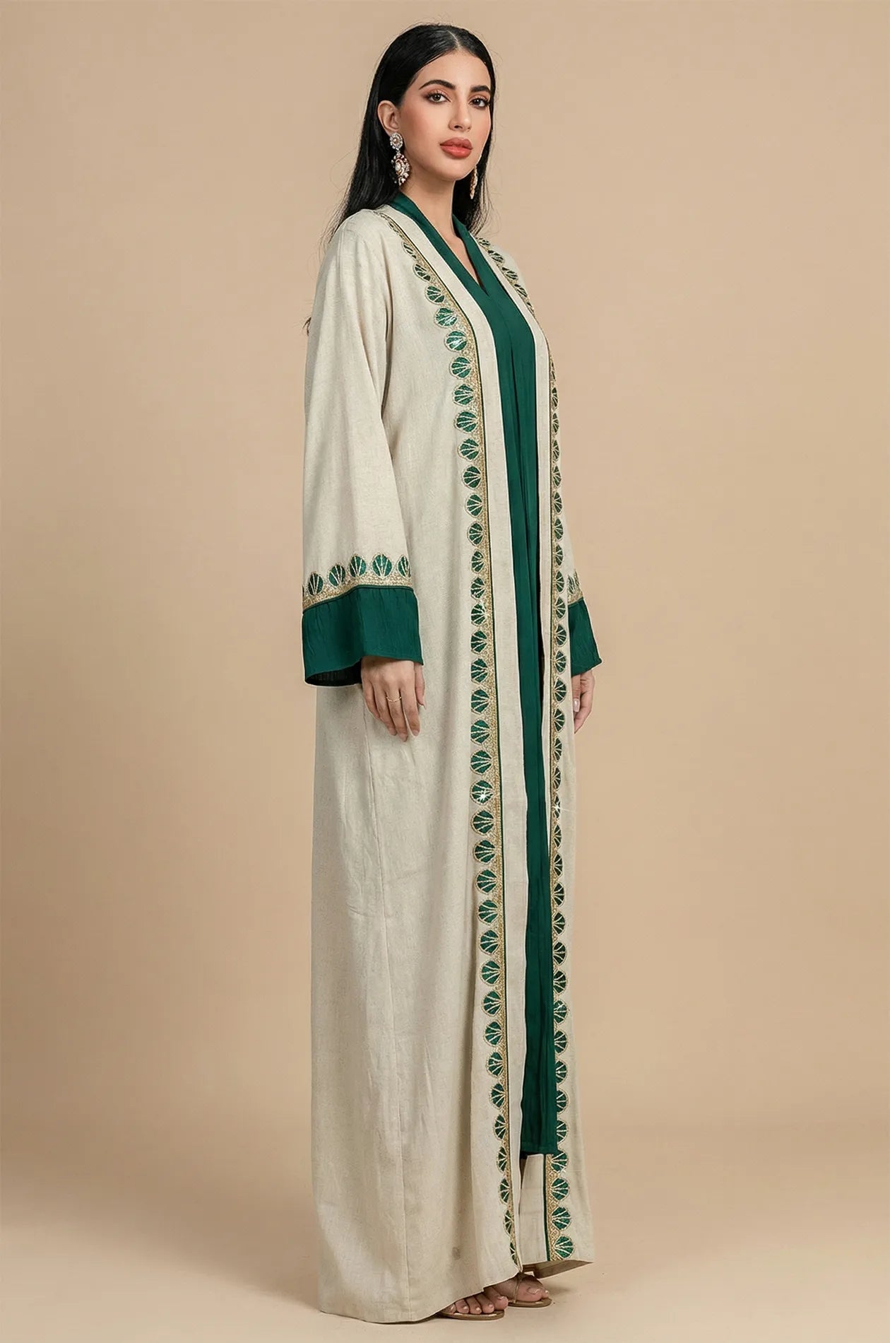 Side profile of the Ameline beige kaftan dress set, showcasing the luxury layering and the flow of the textured fabric.