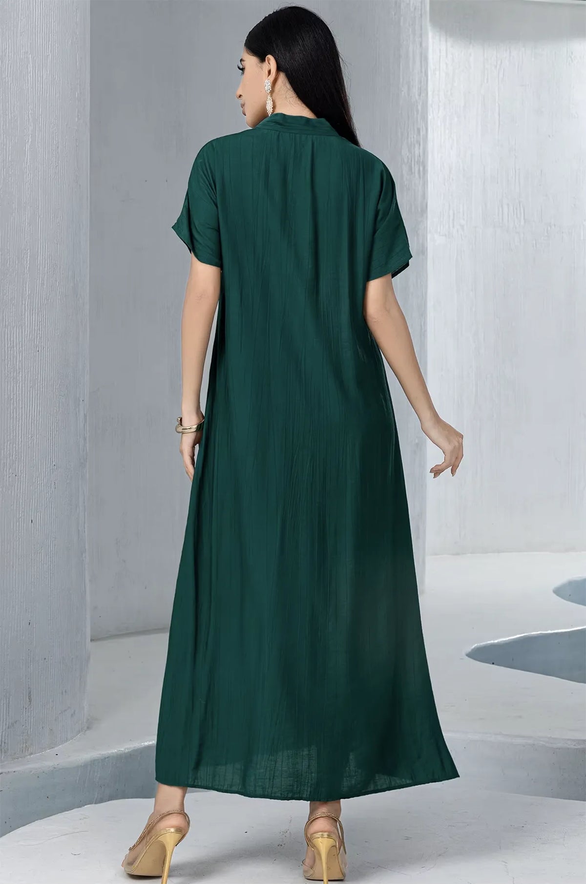 Back view of the ankle-length emerald green pleated inner dress, showcasing the high-quality fabric and soft texture of the Ameline set.