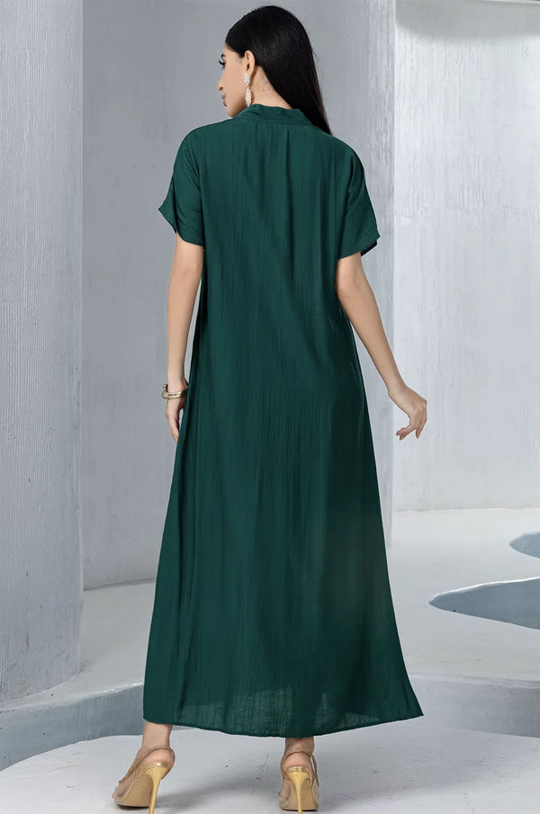 Back view of the ankle-length emerald green pleated inner dress, showcasing the high-quality fabric and soft texture of the Ameline set.