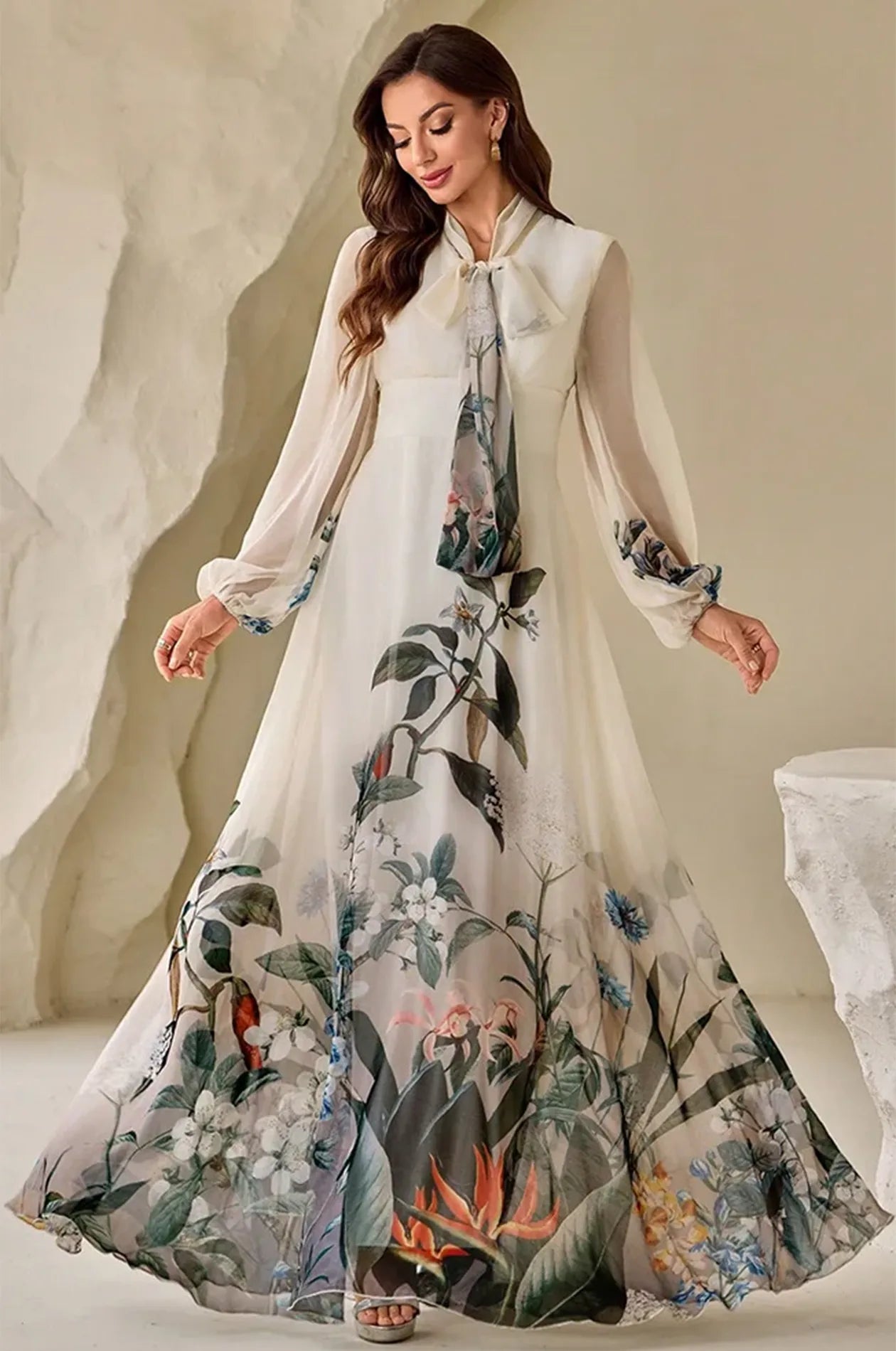The Arina cream kaftan in motion showing the wide, airy hemline.