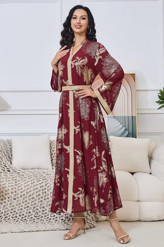 Portrait of a model in the Ayrah maroon kaftan showcasing the V-neck detail.