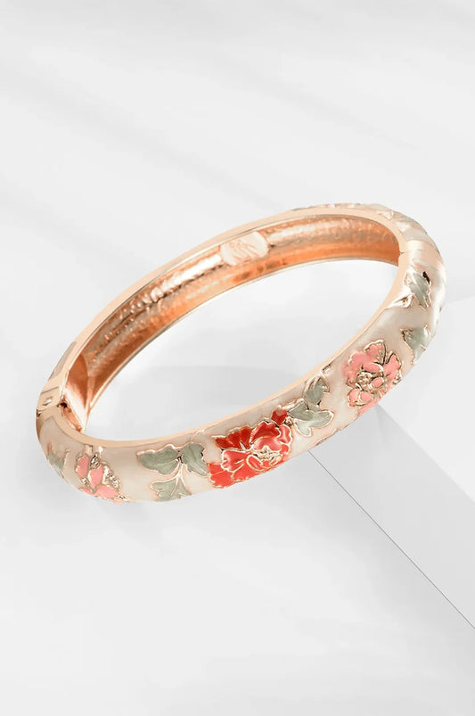 Beige gold-plated hinged bangle displaying intricate floral pattern.
