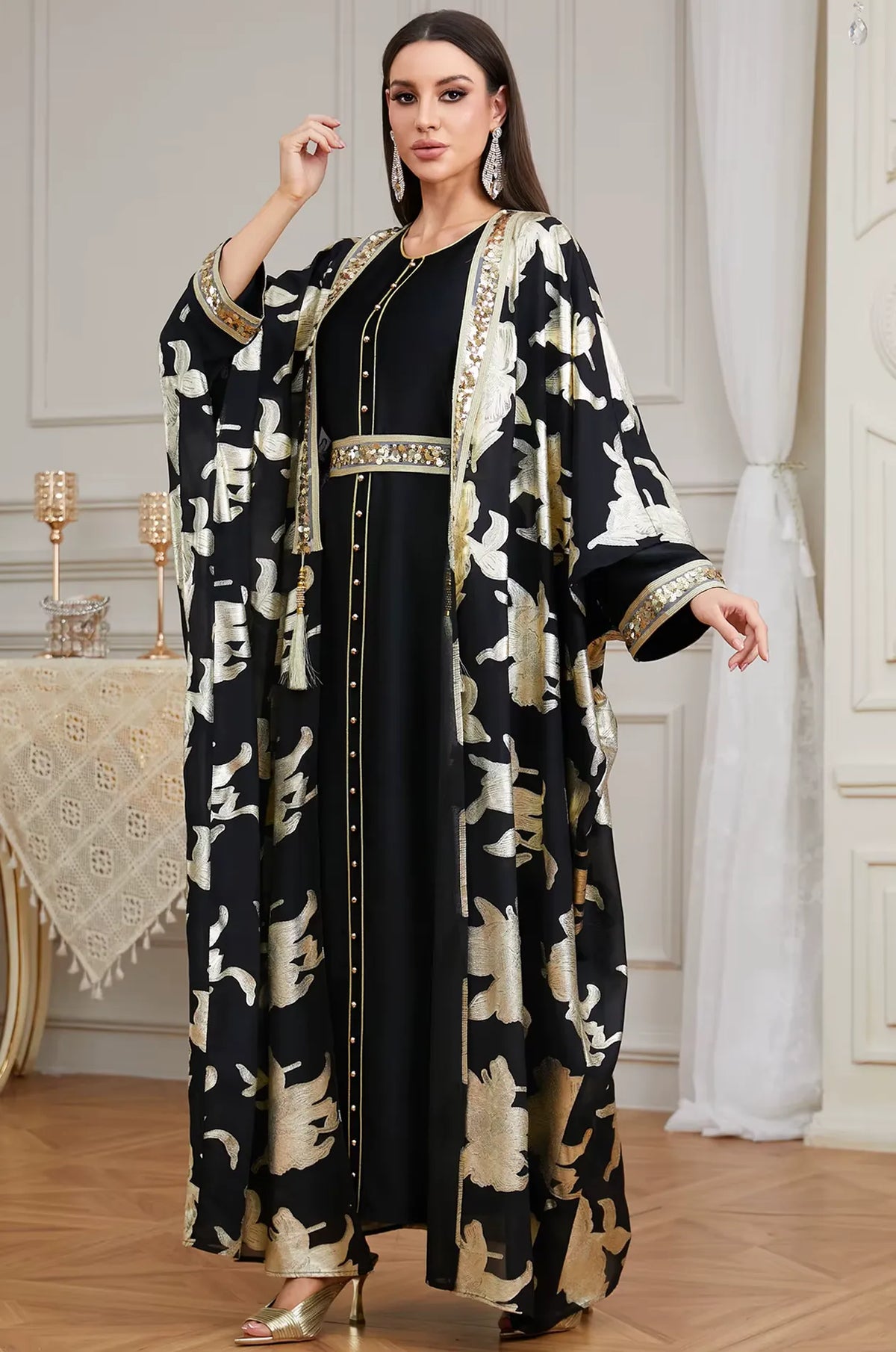 An elegant standing shot of the Black Puppis kaftan luxe by Naylara, a perfect choice for high-end formal evening wear.