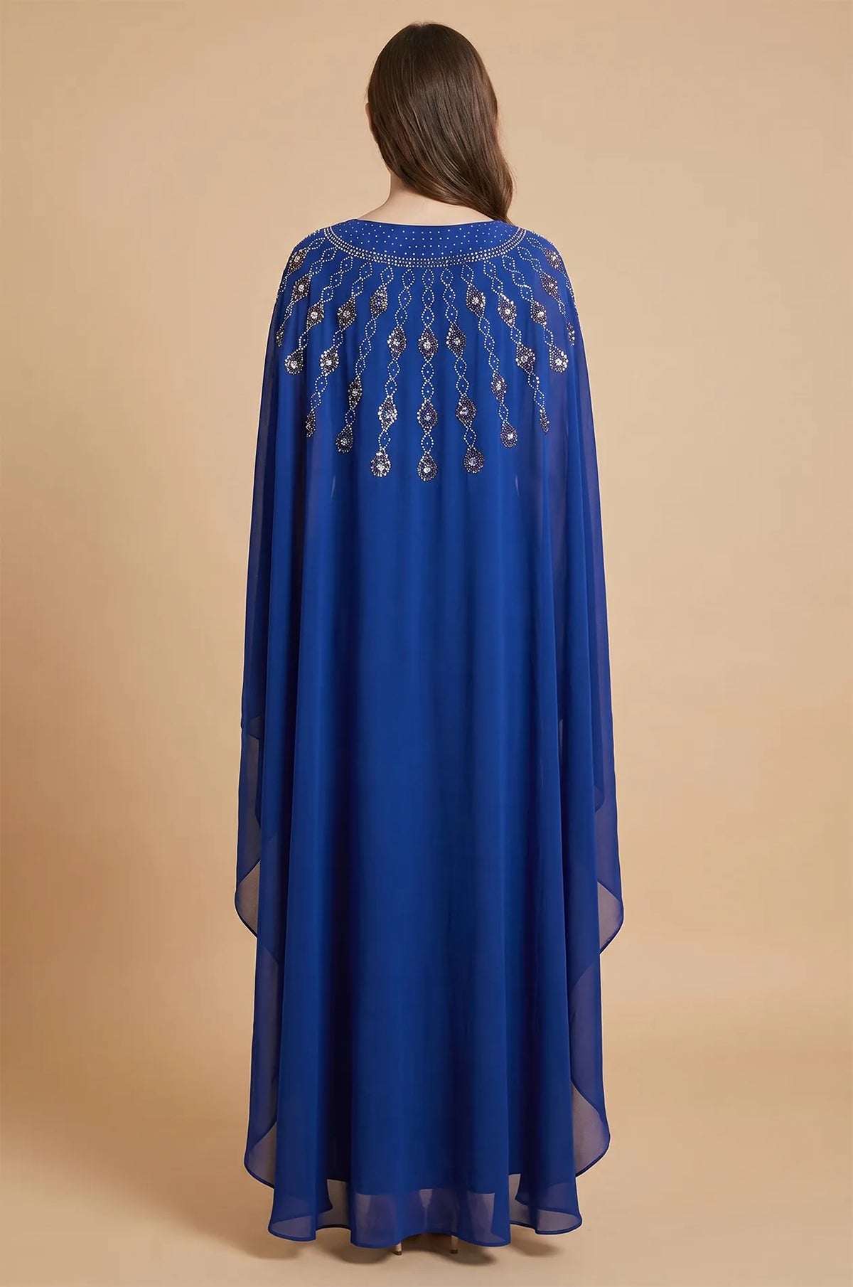 Back view of the Royal Blue Cassia Rhinestone Kaftan highlighting the trailing crystal patterns on the cape.