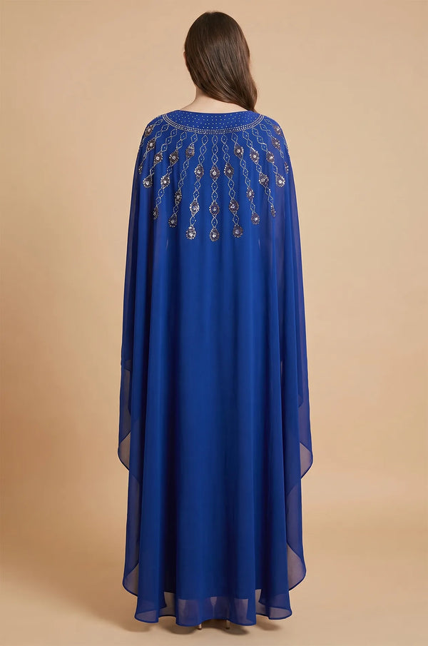 Back view of the Royal Blue Cassia Rhinestone Kaftan highlighting the trailing crystal patterns on the cape.