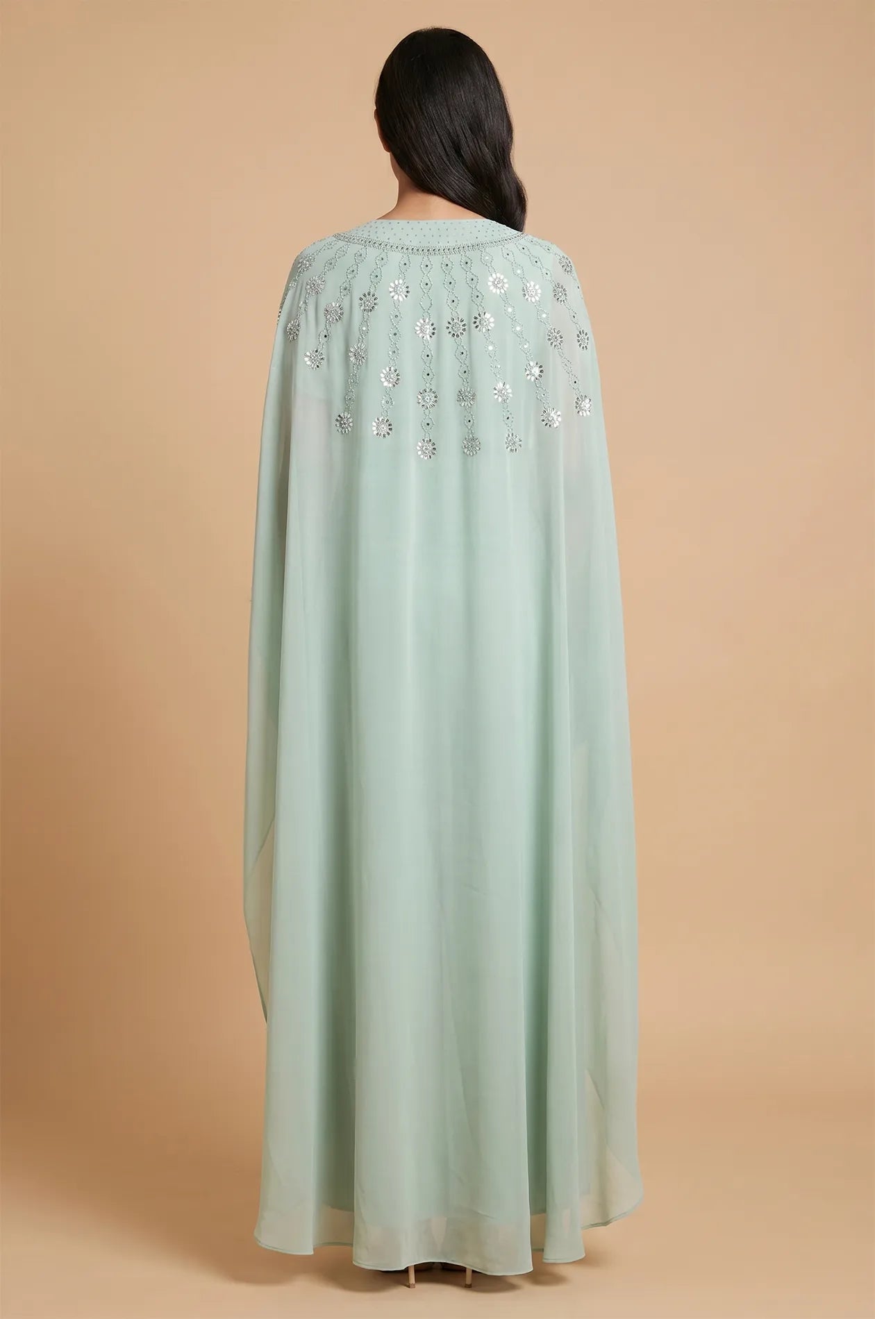 Back view of the Light Green Cassia Rhinestone Kaftan showing the elegant chiffon drape and patterns.