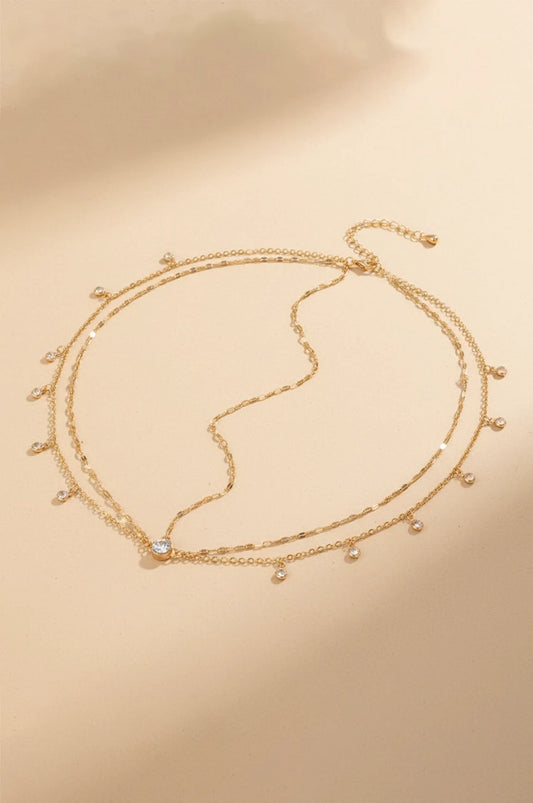 Flat lay of the dainty gold-tone layered head chain with rhinestones.