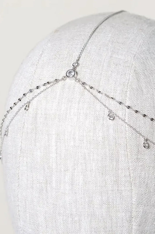 Close-up of the silver layered head chain with rhinestones on a mannequin head.