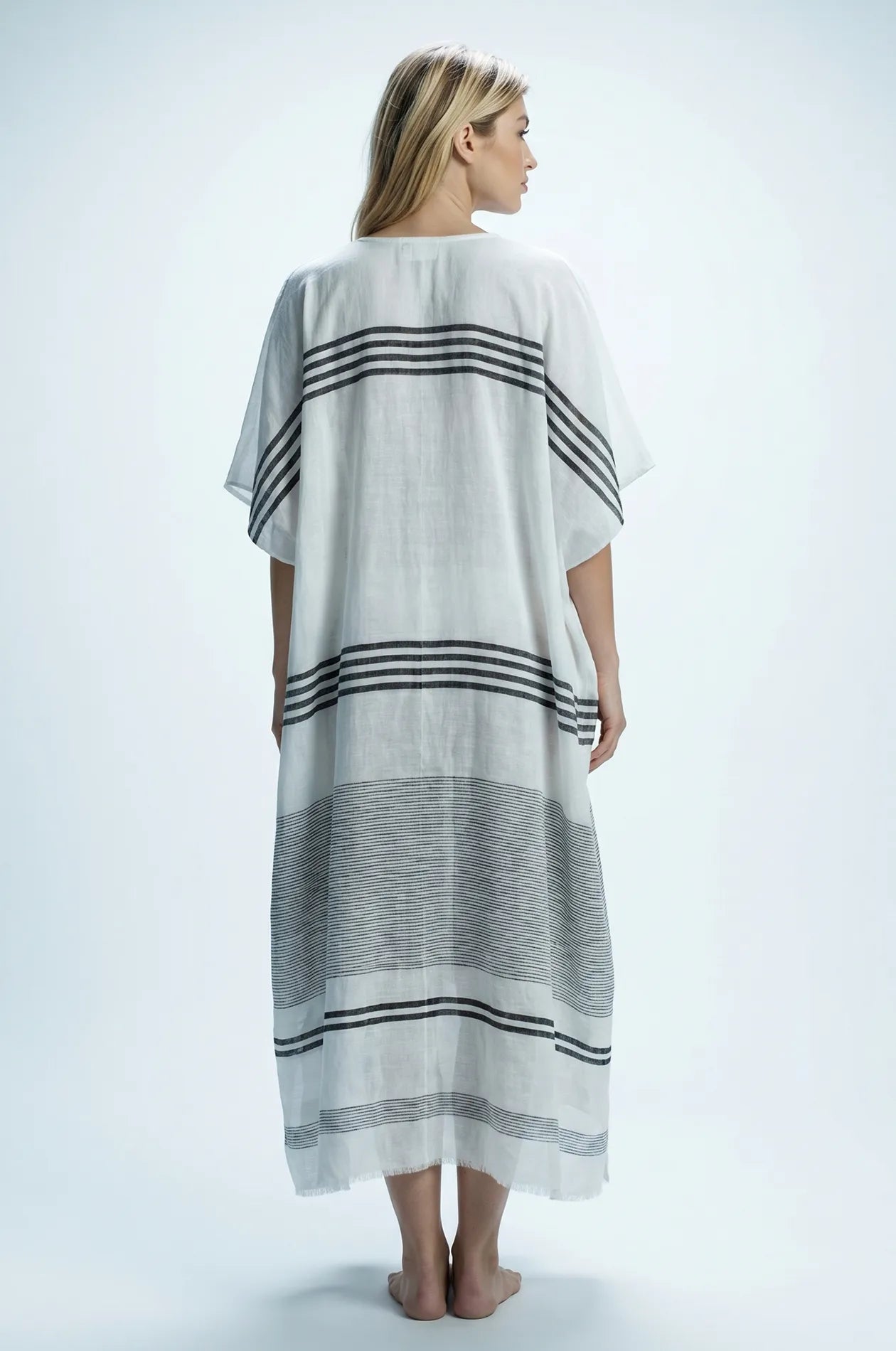 Naylara Dalia lightweight cotton kaftan in ivory white with charcoal stripes — back view, studio