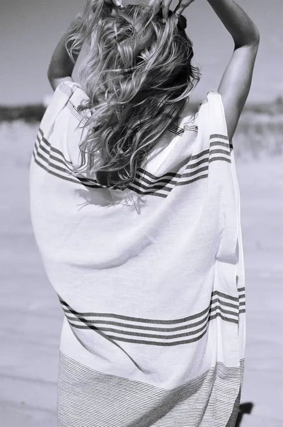 Naylara Dalia striped maxi kaftan in motion on sandy beach — lightweight cotton summer dress