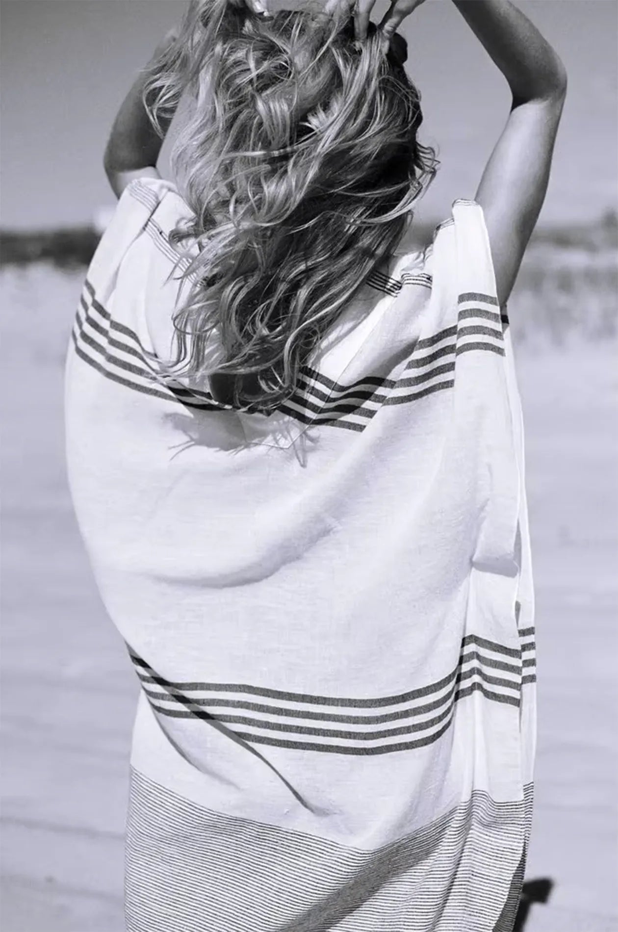 Naylara Dalia striped maxi kaftan in motion on sandy beach — lightweight cotton summer dress