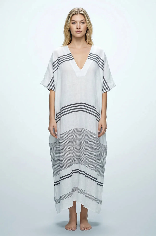 Naylara Dalia white and black striped maxi kaftan — front view with deep V-neck, studio shot