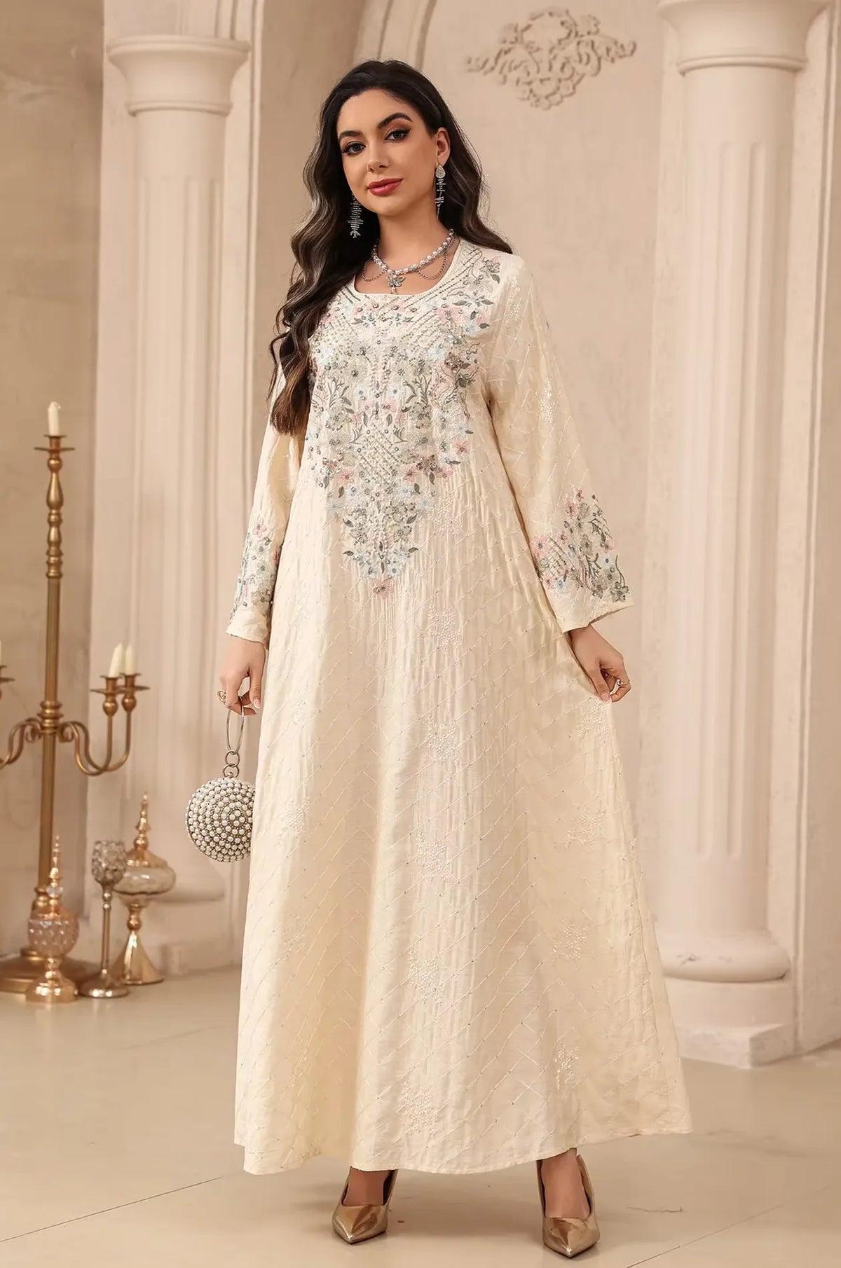 Full-length view of the beige Equis modest kaftan accessorized for formal evening wear.