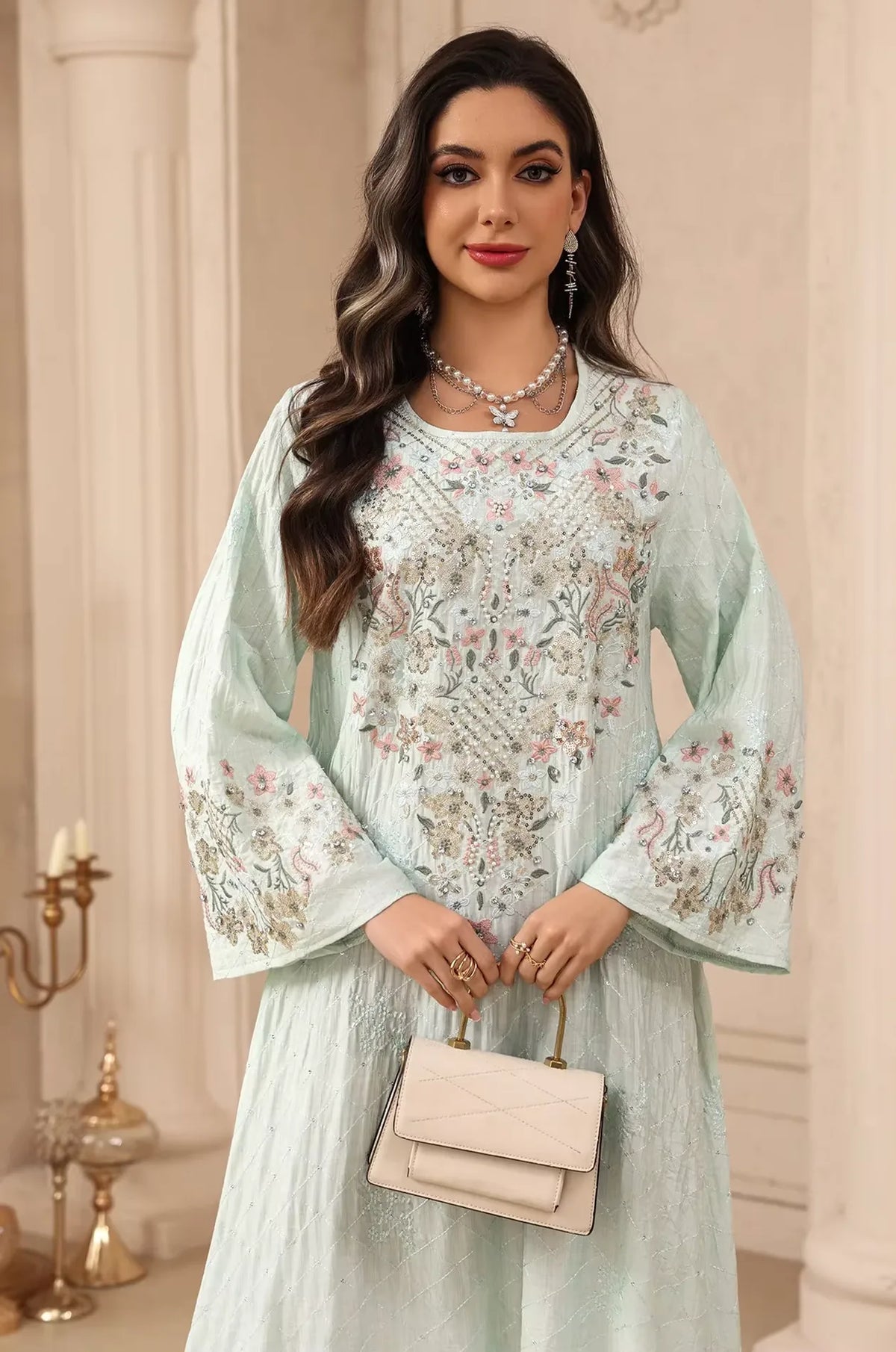 Mid-shot of the green Equis modest kaftan highlighting the sequined floral bodice and elegant round neckline.