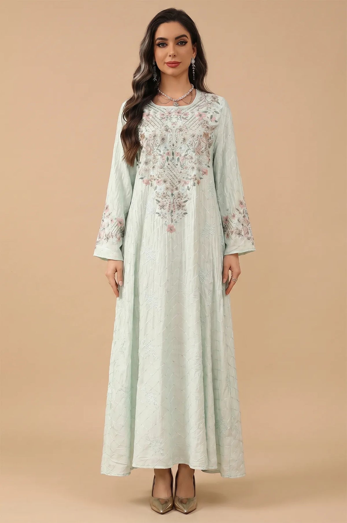 Professional studio portrait of the green Equis floral kaftan showing the full A-line modest silhouette.