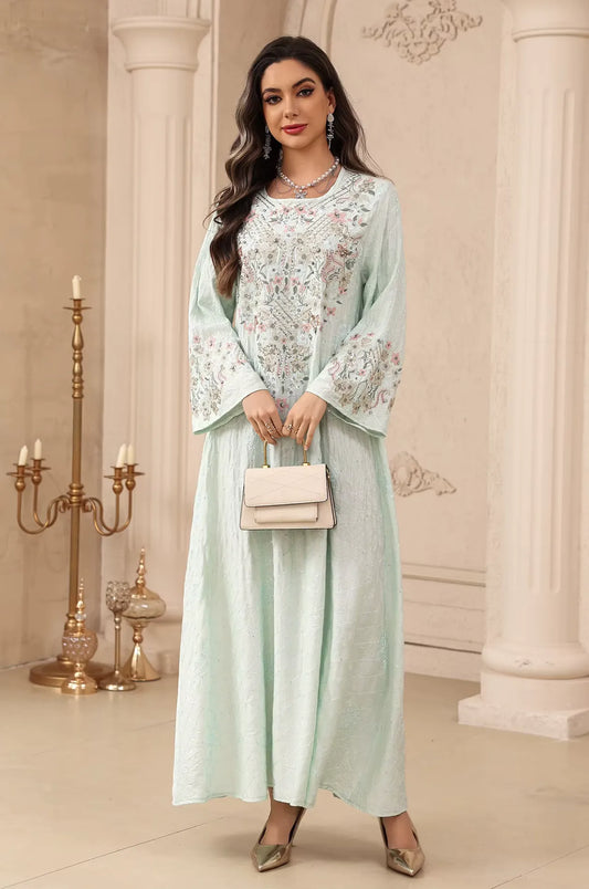 Elegant full-shot of the white Equis floral modest kaftan, perfect for weddings and formal celebrations.