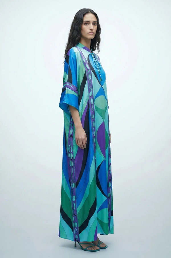 Side view of Naylara Erica tassel kaftan cover up in blue psychedelic print satin
