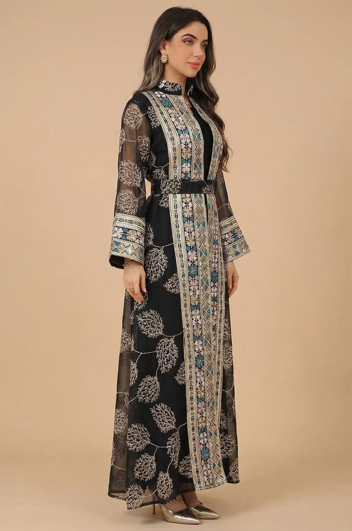 Side profile of the Gienah black chic kaftan by Naylara, emphasizing the coordinated embroidered belt and relaxed silhouette.
