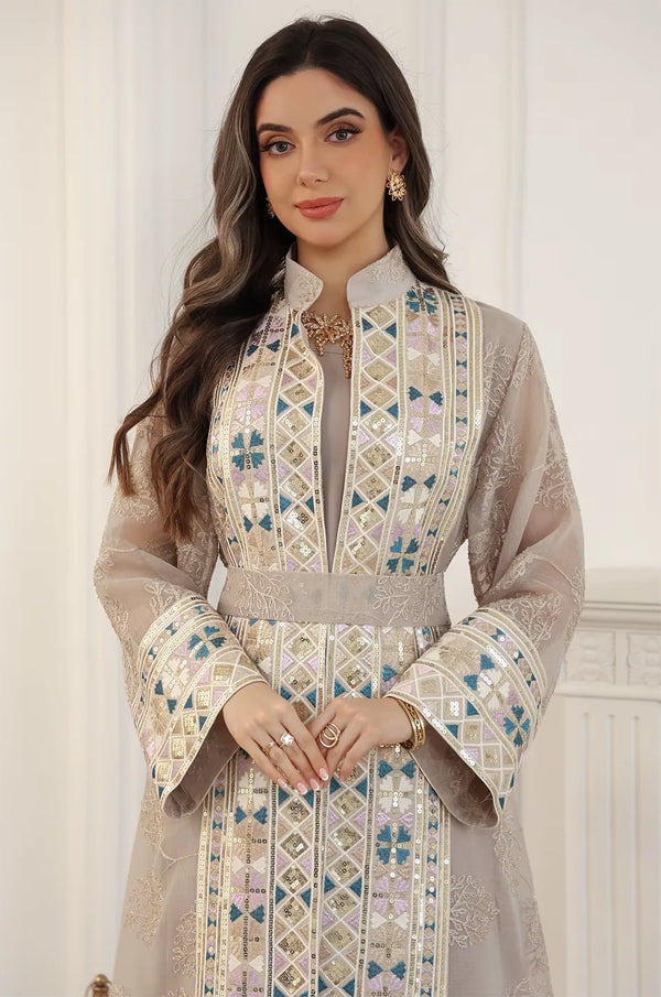 Close-up of the Gienah chic kaftan in apricot beige highlighting the luxury rhinestone and sequin geometric bodice details.