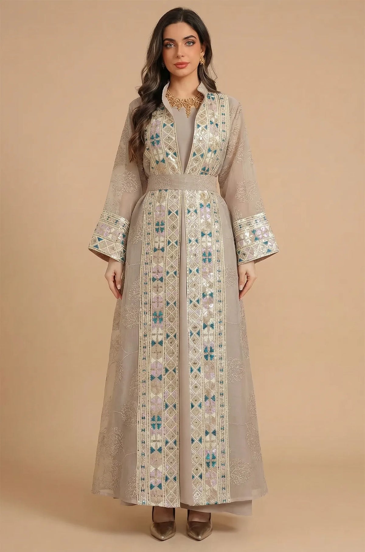 Full front view of the Gienah chic kaftan in apricot beige by Naylara, featuring gold embroidery and a matching belt.